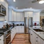 High-end luxury kitchen with granite countertops and white cabin